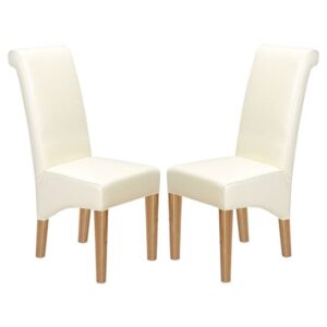 Modals Beige Leather Dining Chairs In A Pair With Wooden Legs